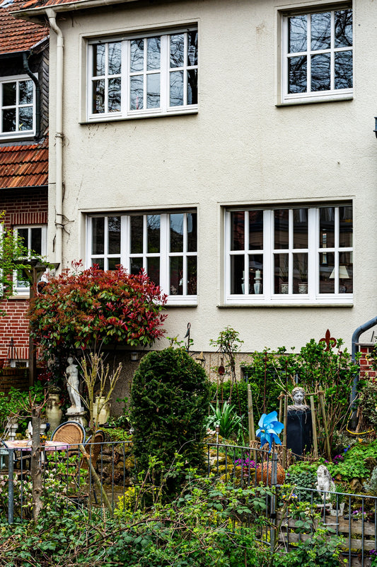 A house with a lush garden and many decorations