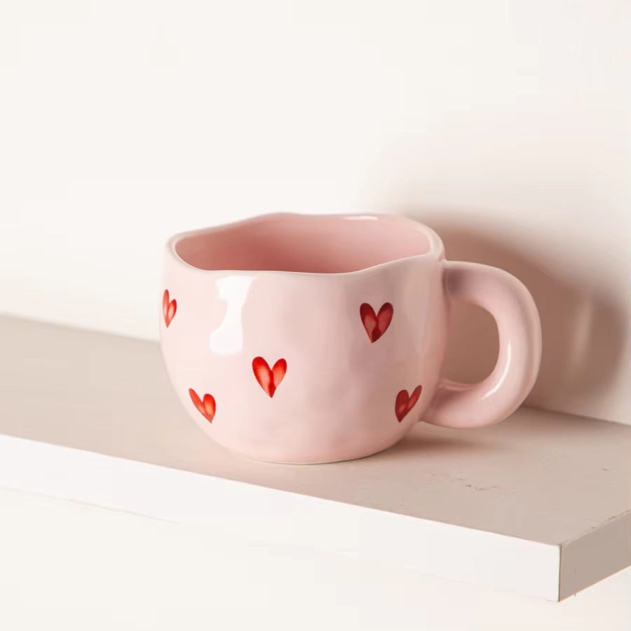 Ceramic cup with red heart and handle