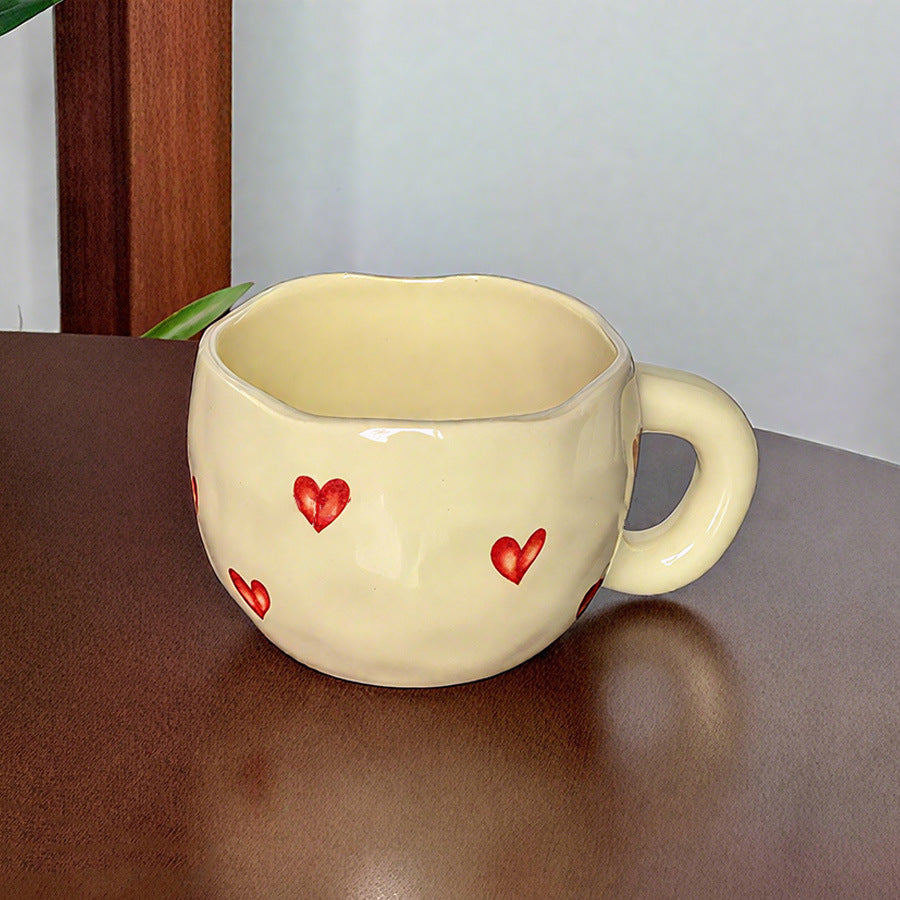 Ceramic cup with red heart and handle