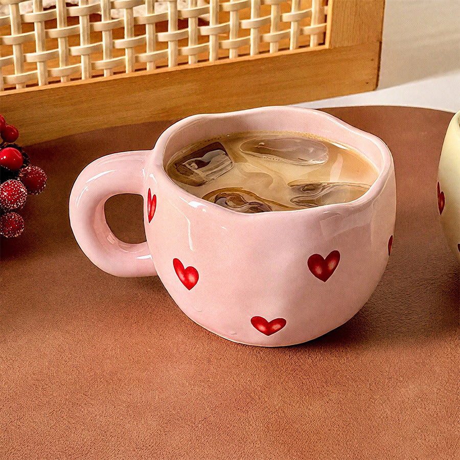Ceramic cup with red heart and handle