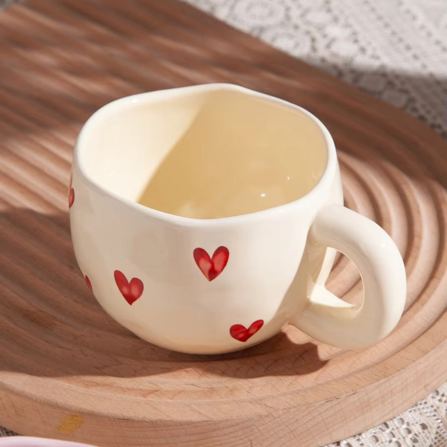 Ceramic cup with red heart and handle